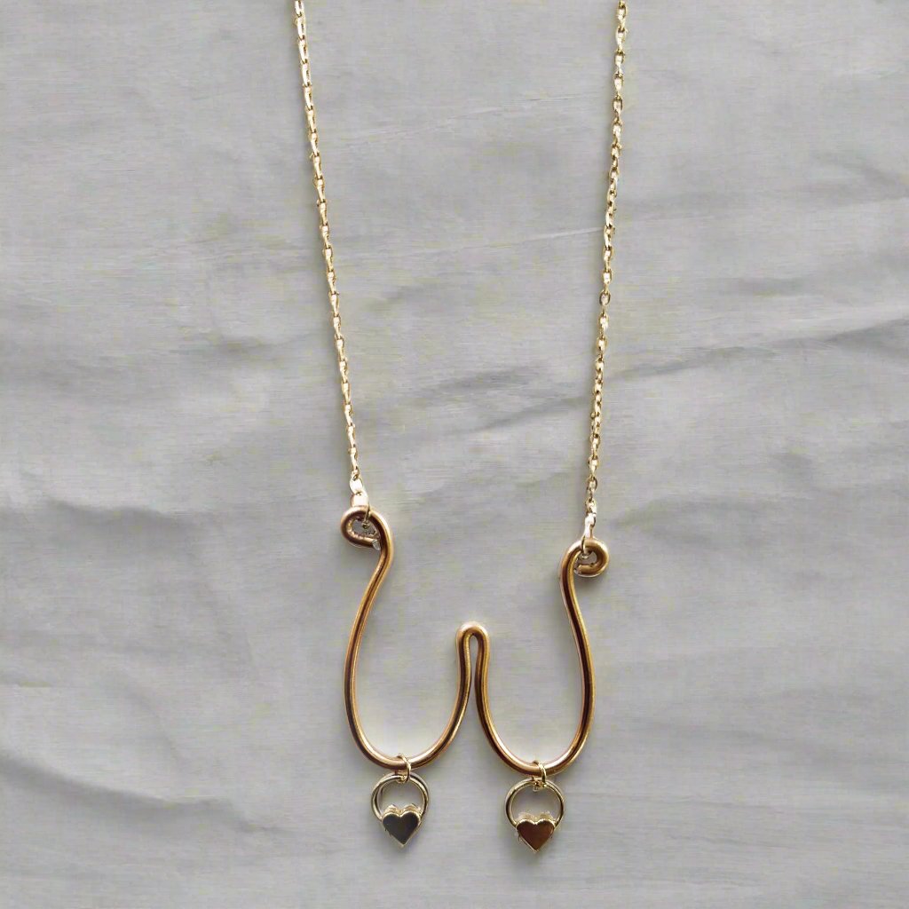 boob necklace with heart charms
