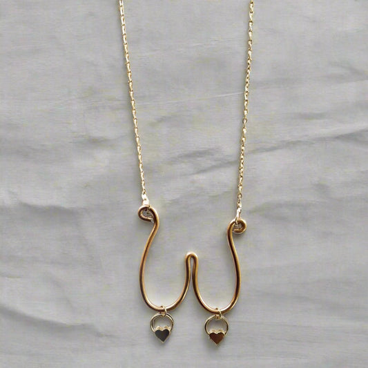 boob necklace with heart charms