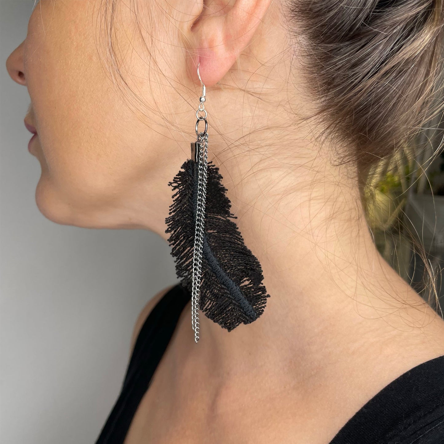 she-bang is upcycled handmade unique feather earrings, unique jewelry, made from recycled denim materials and chains, completely one of a kind jewelry made by local brooklyn designers