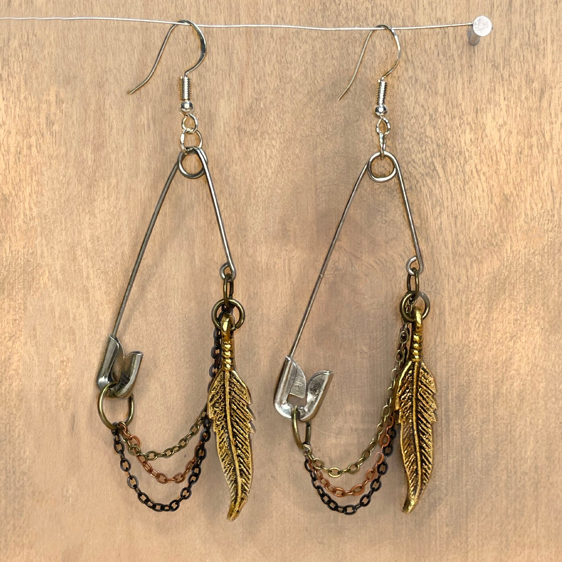 she-bang is upcycled handmade unique safety pin earrings, unique jewelry, made from recycled materials and chains, completely one of a kind jewelry made by local brooklyn designers.