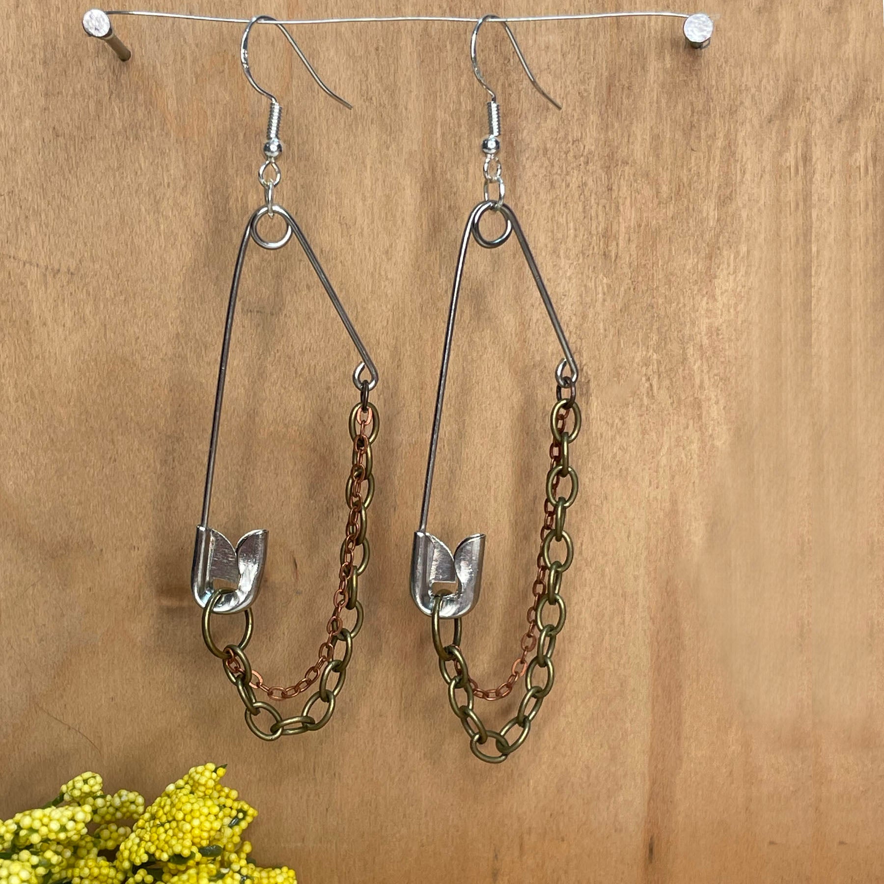 she-bang is upcycled handmade unique safety pin earrings, unique jewelry, made from recycled materials and chains, completely one of a kind jewelry made by local brooklyn designers.