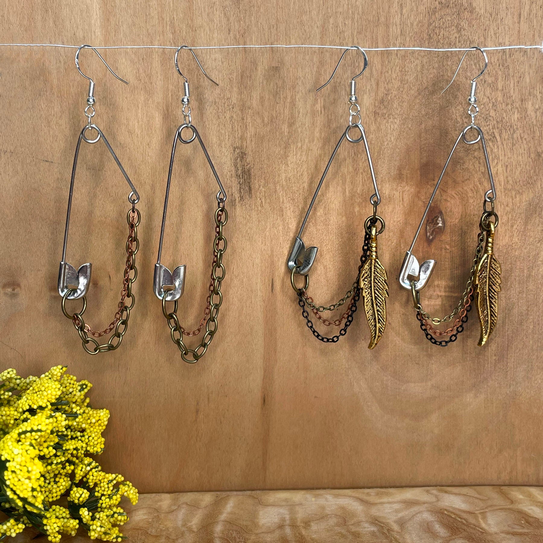 she-bang is upcycled handmade unique safety pin earrings, unique jewelry, made from recycled materials and chains, completely one of a kind jewelry made by local brooklyn designers.