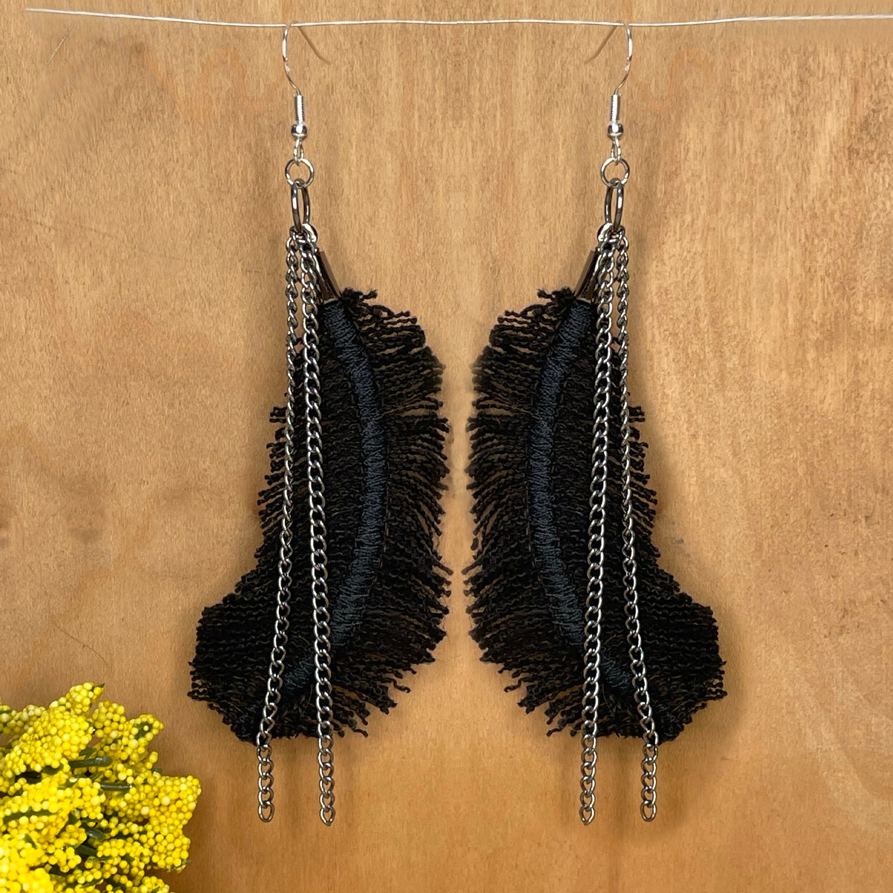 she-bang is upcycled handmade unique feather earrings, unique jewelry, made from recycled denim materials and chains, completely one of a kind jewelry made by local brooklyn designers