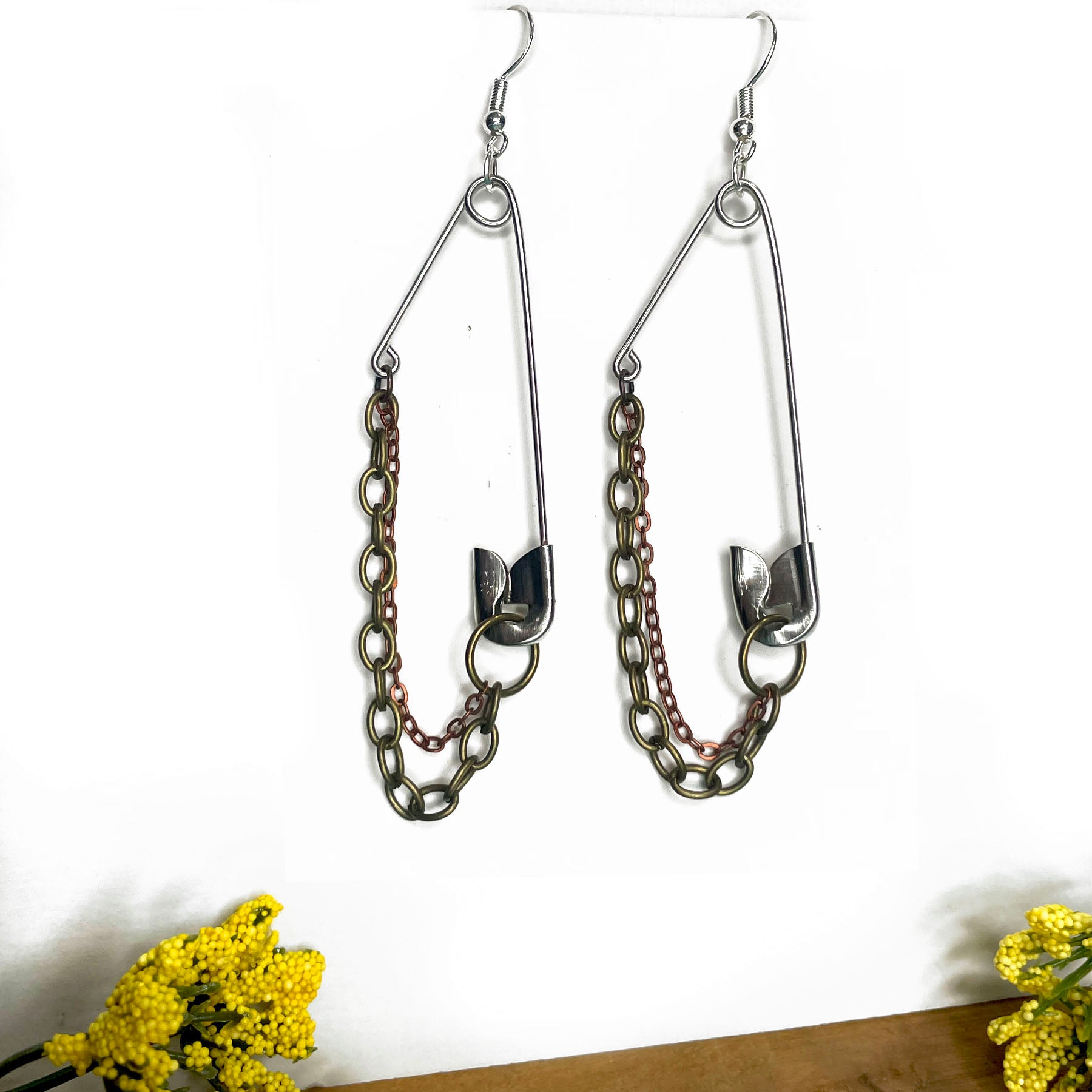 she-bang is upcycled handmade unique safety pin earrings, unique jewelry, made from recycled materials and chains, completely one of a kind jewelry made by local brooklyn designers.